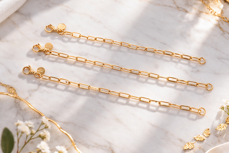 CharmFlip gold extension chains in 8, 10 and 12 inch lengths, flat lay on marble