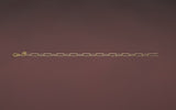 CharmFlip gold 10 inch extender chain rotating 360 degrees on red velvet