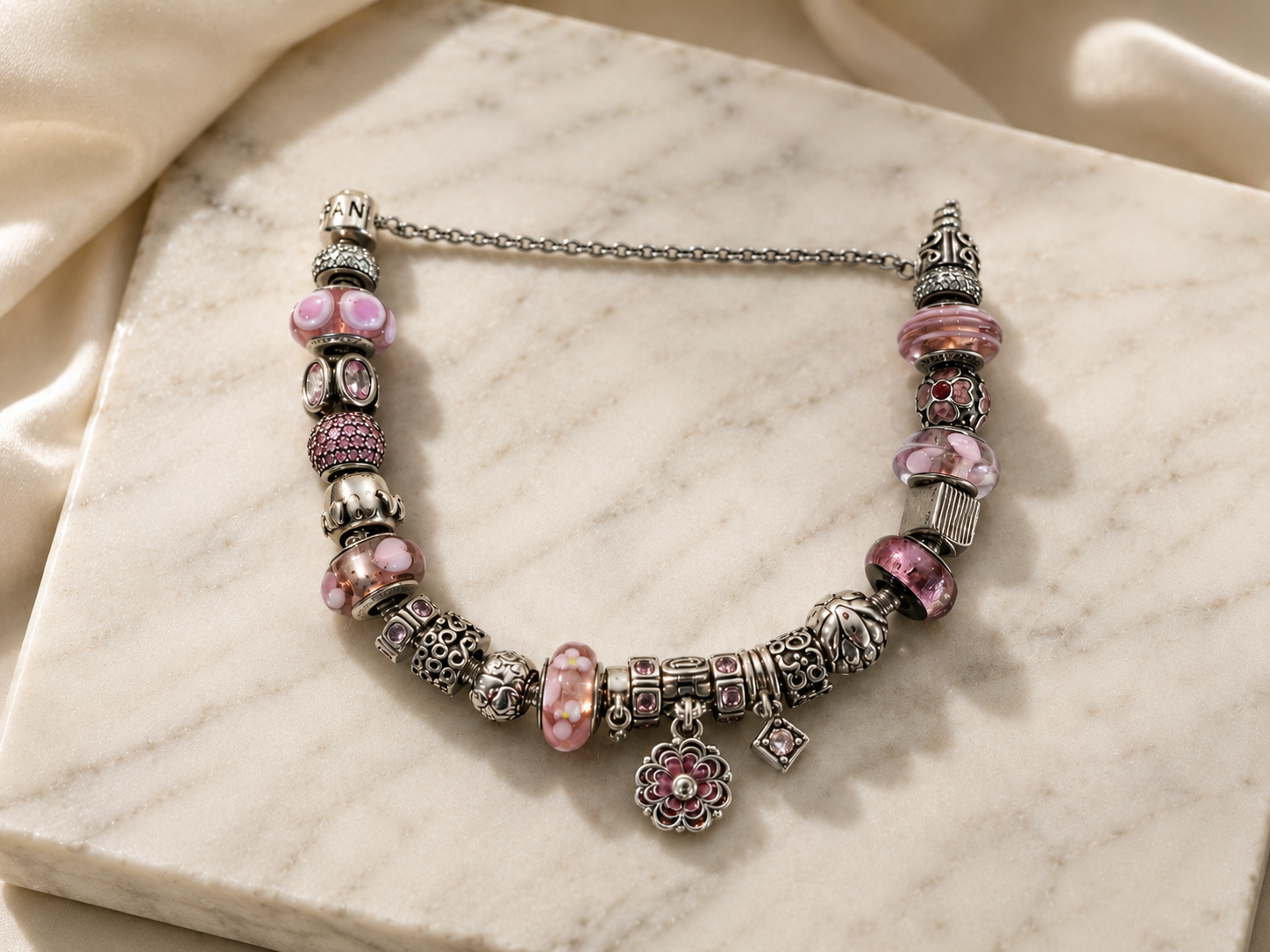 Pandora bracelet with the safety chain clipped across the opening